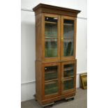 A Victorian oak two tier bookcase cabinet