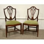 A pair of George III mahogany Hepplewhite style dining chairs and a stool