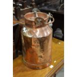 A large copper milk container