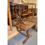 An extending leaf table and a round table