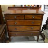 A wooden chest of drawers