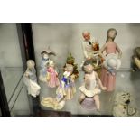 A collection of Lladro, Royal Doulton and continental figures