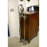 A large stainless steel floor mounted shower stand
