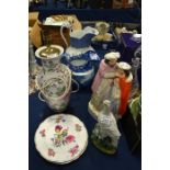 A selection of porcelain including two jugs, a lamp, plates and figures
