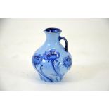 William Moorcroft for James Macintyre, poppy blue on blue miniature jug, bulbous form