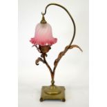 An Arts and Crafts brass and copper table lamp, in the style of W A S Benson
