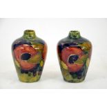 William Moorcroft, a pair of Pomegranate vase's, shouldered form, ochre ground