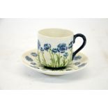 William Moorcroft for James Macintyre, poppy on white ground cup and saucer,