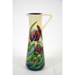 A Moorcroft 1997 Collectors Club jug, with iris decoration and strap handle, by Rachel Bishop