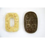 Two Chinese archaistic carved stone pendants