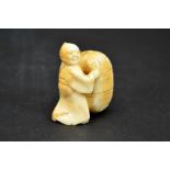 λ A 19th century Japanese carved ivory netsuke, Meiji