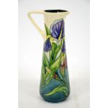 A Moorcroft 1997 Collectors Club jug, with iris decoration and strap handle, by Rachel Bishop,