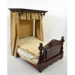 A Victorian mahogany dolls half tester bed