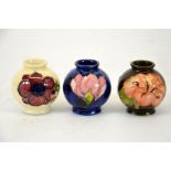 Walter Moorcroft, a group of three miniature vase's, ovoid form, circa 1970