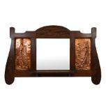 An Arts and Crafts mahogany wall mounted mirror