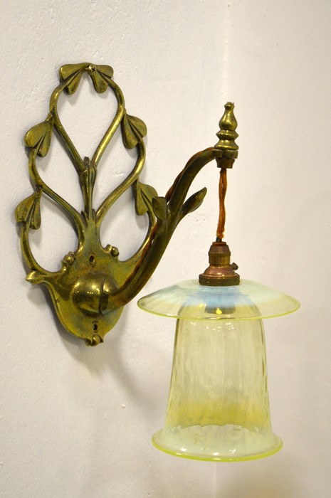 W A S Benson and James Powell and Sons, an Arts and Crafts brass wall light, model 1312