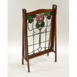 Liberty and Co., an Arts and Crafts mahogany and stained glass fire screen