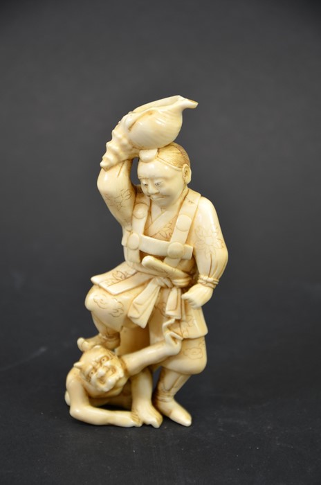 λ A 19th century Japanese carved ivory okimono
