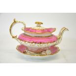 A Minton pink and gilt teapot on stand, pattern 200