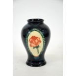 A Moorcroft Collectors Club 1994 vase, with orange rose in wreaths decoration