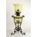 James Powell and Sons, an Arts and Crafts opalescent glass and wrought iron table oil lamp