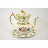 A Rockingham floral painted teapot and stand