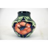 A Moorcroft trial 1996 vase, with poppies and foliage decoration on blue ground,