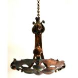 An Arts and Crafts copper pendant light fitting, circa 1900