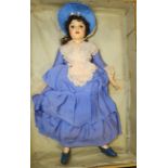 DOLL WITH PAINTED WOODEN FACE, BUST & HALF LIMBS IN BONNET & PURPLE CREPE DRESS 22'L