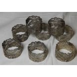 SET OF FILIGREE WHITE METAL NAPKIN RINGS