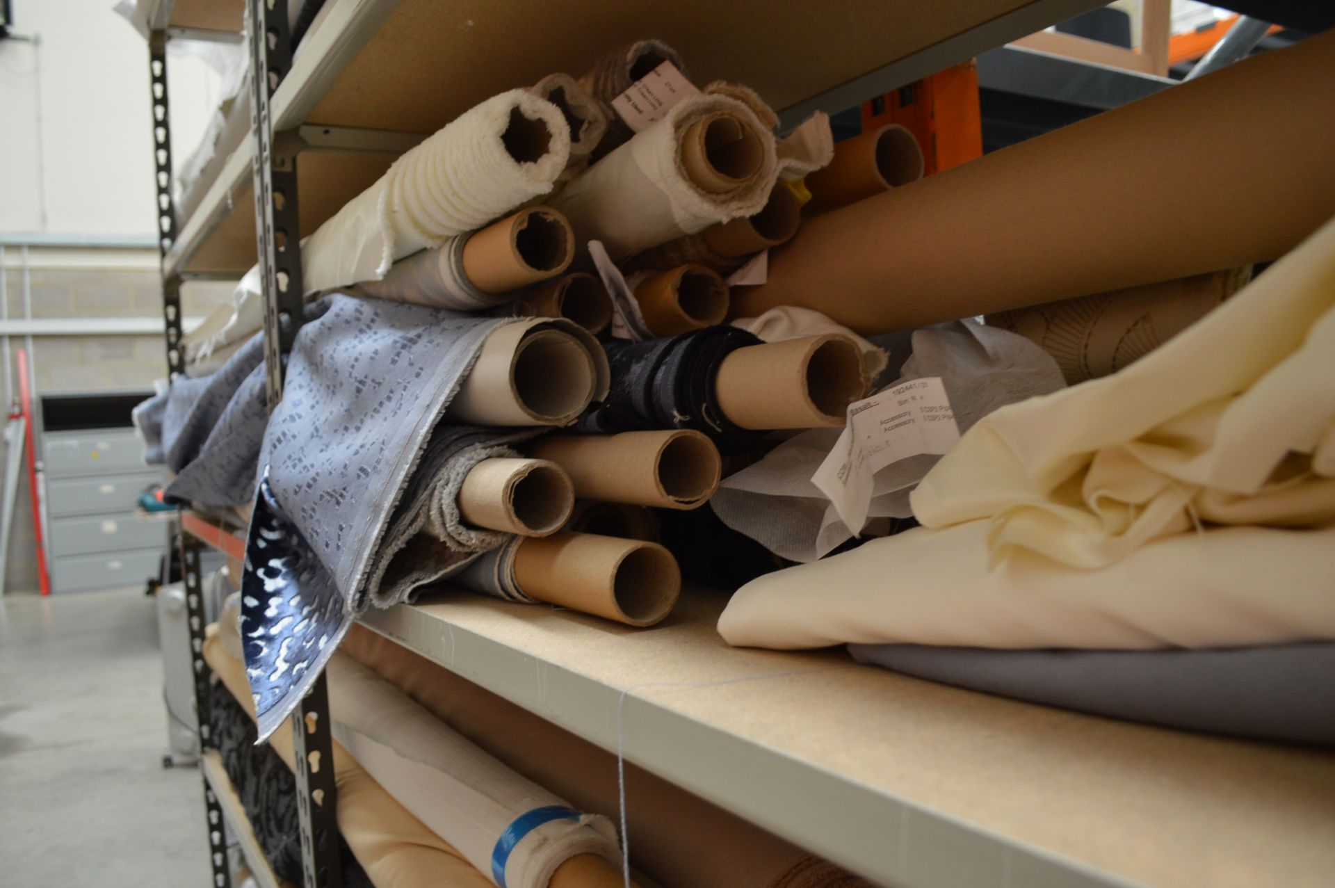 Quantity of Assorted Fabric Various Lengths & Colours includes Racking as shown (Please Note: item - Bild 14 aus 15