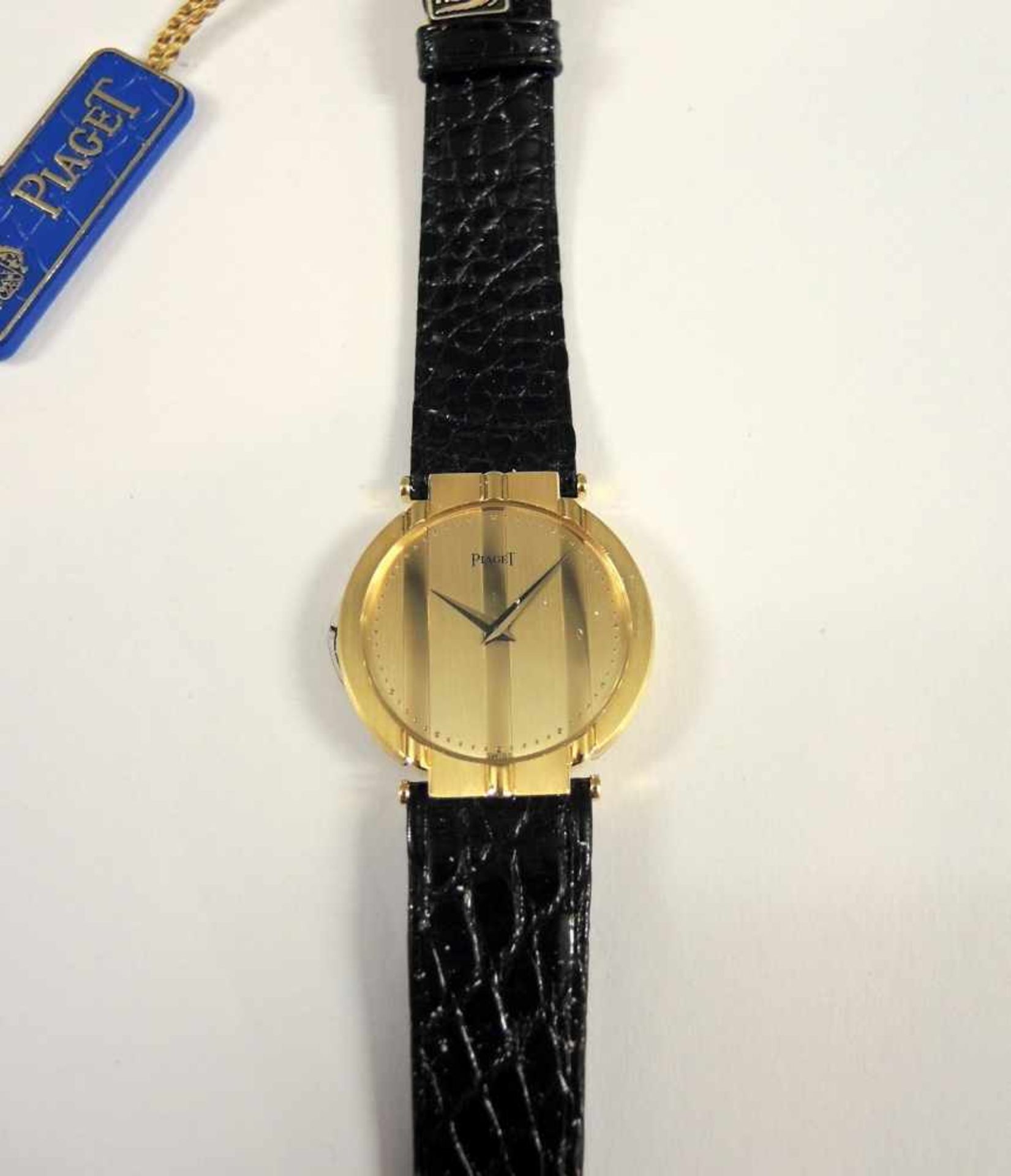 Piaget, Armbanduhr18 K. Gelbgold, mit Goldschließe und schwarzem Lederband. Quartz, in neuwertigem