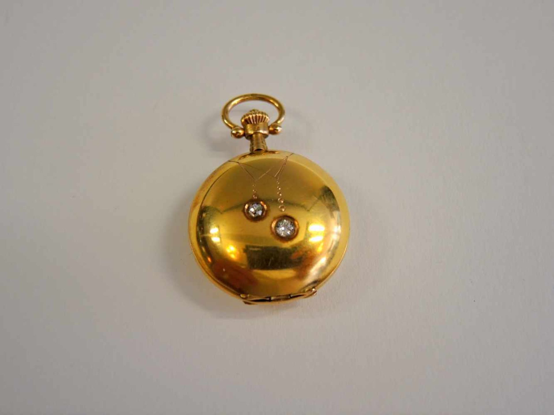 Feine Damen-Umhängeuhr14 K. Gelbgold, mit Diamanten, gangbar. Ø ca. 25 mm, Gewicht 16 g - Bild 2 aus 2