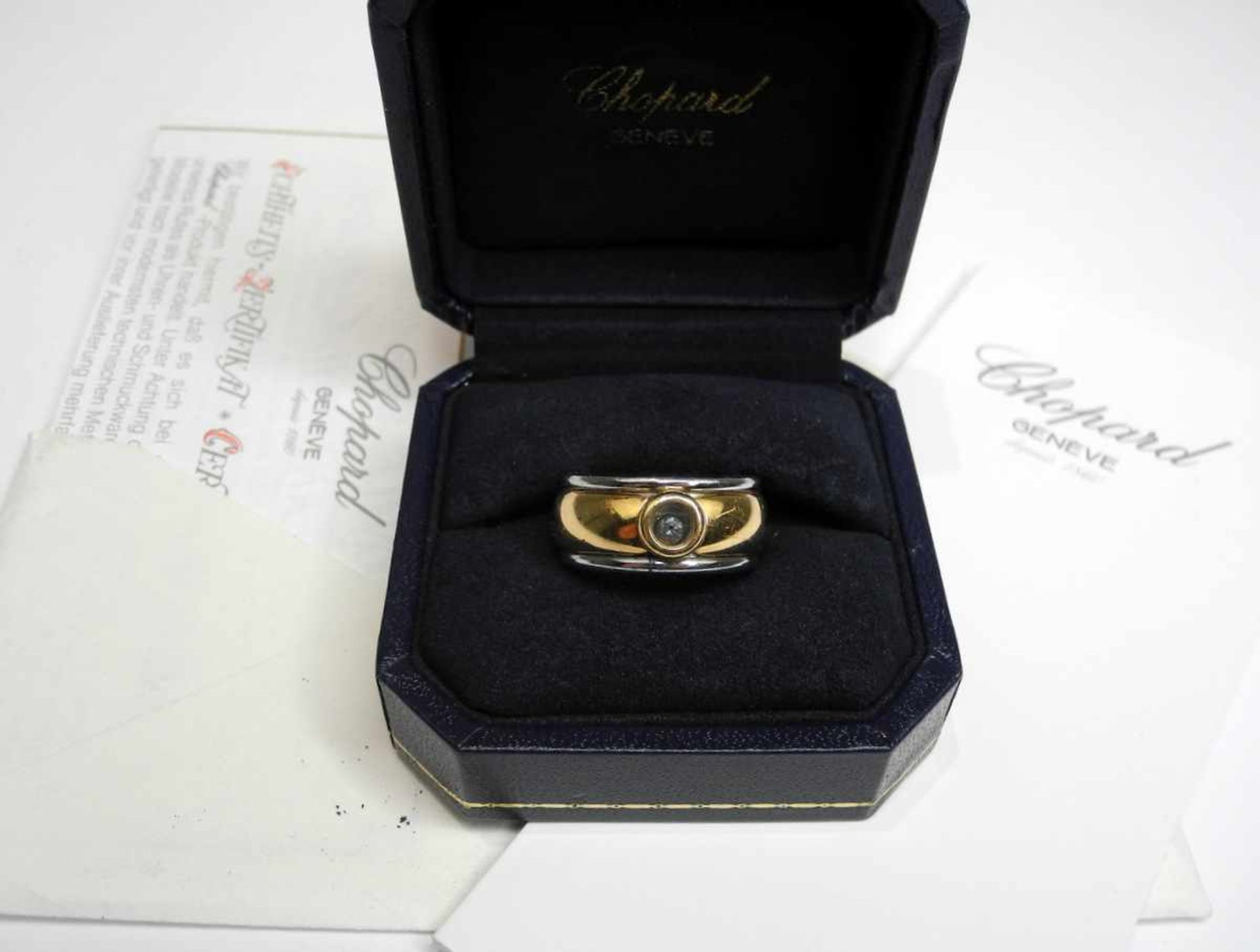 Chopard, Ring18 K. Gelbgold und Stahl. Mit kleinem Diamanten von ca. 0,10 ct. Mit Papieren.