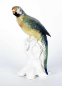 Porzellanmanufaktur ENS Papagei auf knorrigem Baum Porzellan, farbig glasiert; H 24,5 cm; Marke "