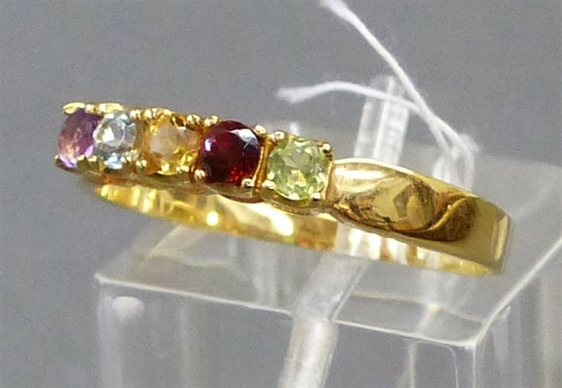 Damenring 9 kt. Gelbgold, 5 verschiedene Edelsteine, Amethyst, Citrin, Granat, etc., ca. 2 g schwer,