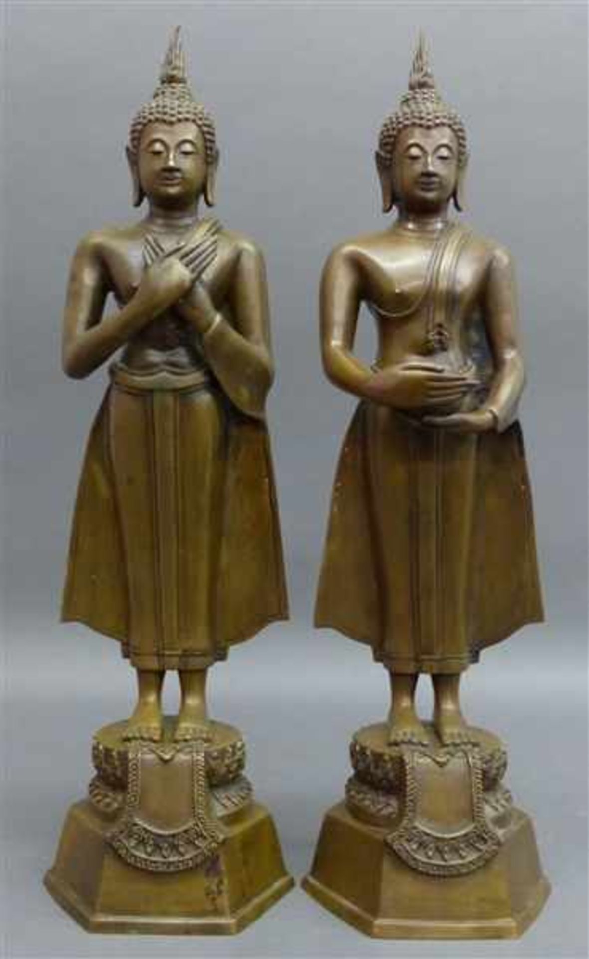 Paar BronzeskulpturenIndonesien um 1950, stehende Buddhaskulpturen, teilweise mit Gefäßen, h 60cm,