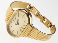Damen-Armbanduhr "Glashütte" Vergoldetes Gehäuse. Querovale Form. Goldenes, horizontal gerieftes