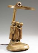 Figurative Tischlampe von Peter Tereszczuk1-flg. Bronze, ehem. braun patiniert. Auf Stand mit Ablage