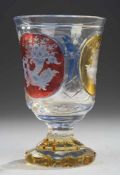 Biedermeier-PokalFarbloses Glas, part. rot, gelb u. blau gebeizt. Formgeblasen u. geschliffen.