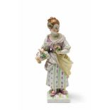 A Berlin KPM porcelain gardener girl with a basket of flowers Model no. 404 A. Blue sceptre mark