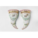 A pair of Berlin KPM porcelain cornucopia wall vases A facing pair of flat-backed hollow horns,