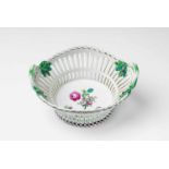 A Berlin KPM porcelain basket with a tri-coloured bouquet Model no. 674. Round basket with branch-