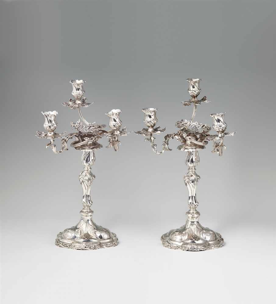 A pair of Copenhagen silver Rococo candelabra Each with a waisted baluster shaft with finely
