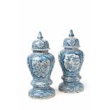 A pair of faience vases with Delft style decor With Chinoiserie plant, bird, spiral, and