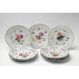 Eight Berlin KPM porcelain dessert plates with flowers and insects Model no. 189. Decorated to the