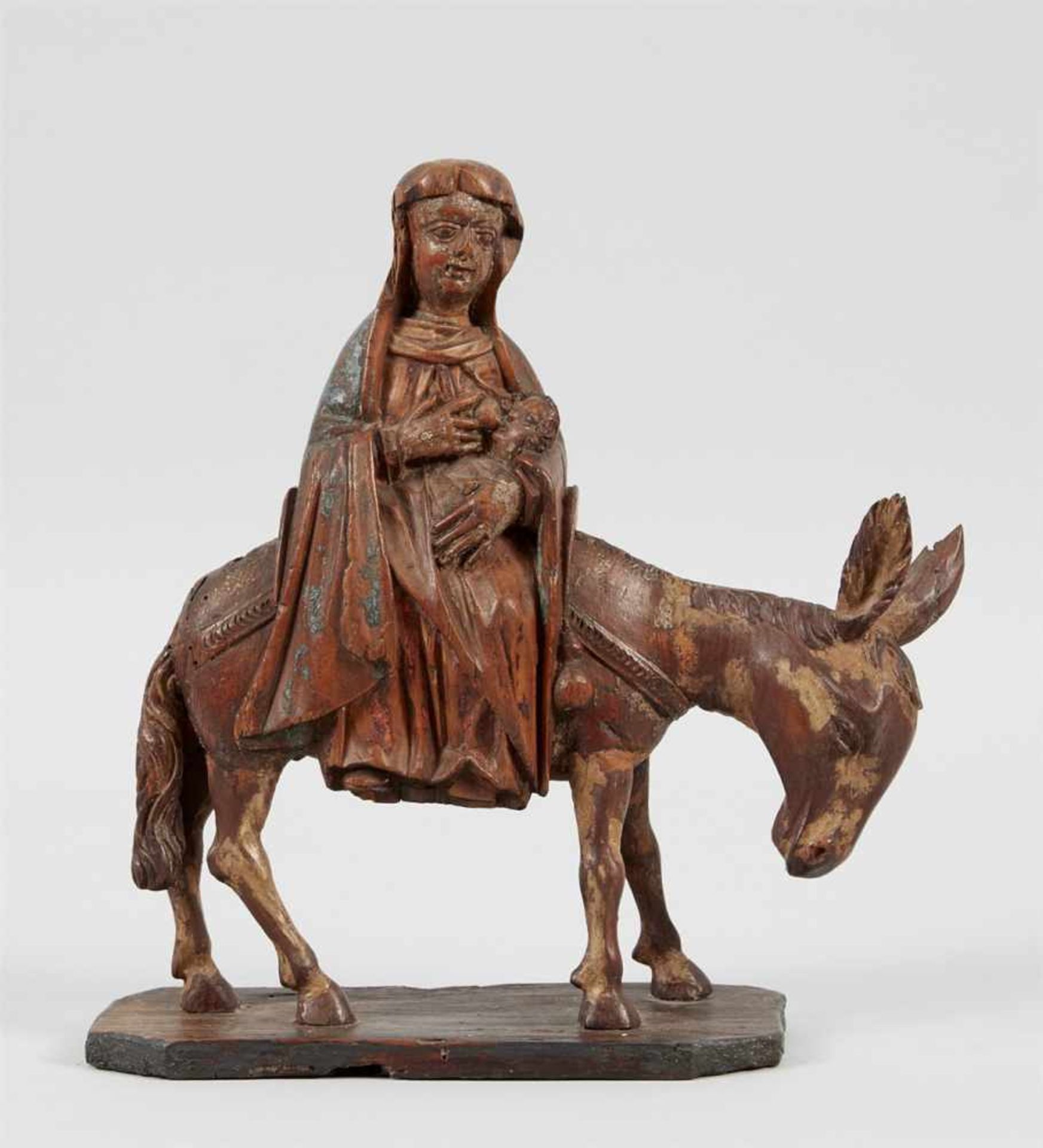 Maria mit Kind auf einem Esel reitend Holz, geschnitzt. Aus "Flucht nach Ägypten".Reste von