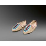 PAIR OF IROQUOIS CHILD'S BEADED MOCCASINS 11 cm. long PAIR OF IROQUOIS CHILD'S BEADED MOCCASINS 11