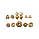 DAYAK BRASS EAR ORNAMENTS Five pairs and a single ear ornament 2 to 6 cm. long DAYAK BRASS EAR