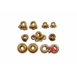 DAYAK BRASS EAR ORNAMENTS Five pairs and a single ear ornament DAYAK BRASS EAR ORNAMENTS Five